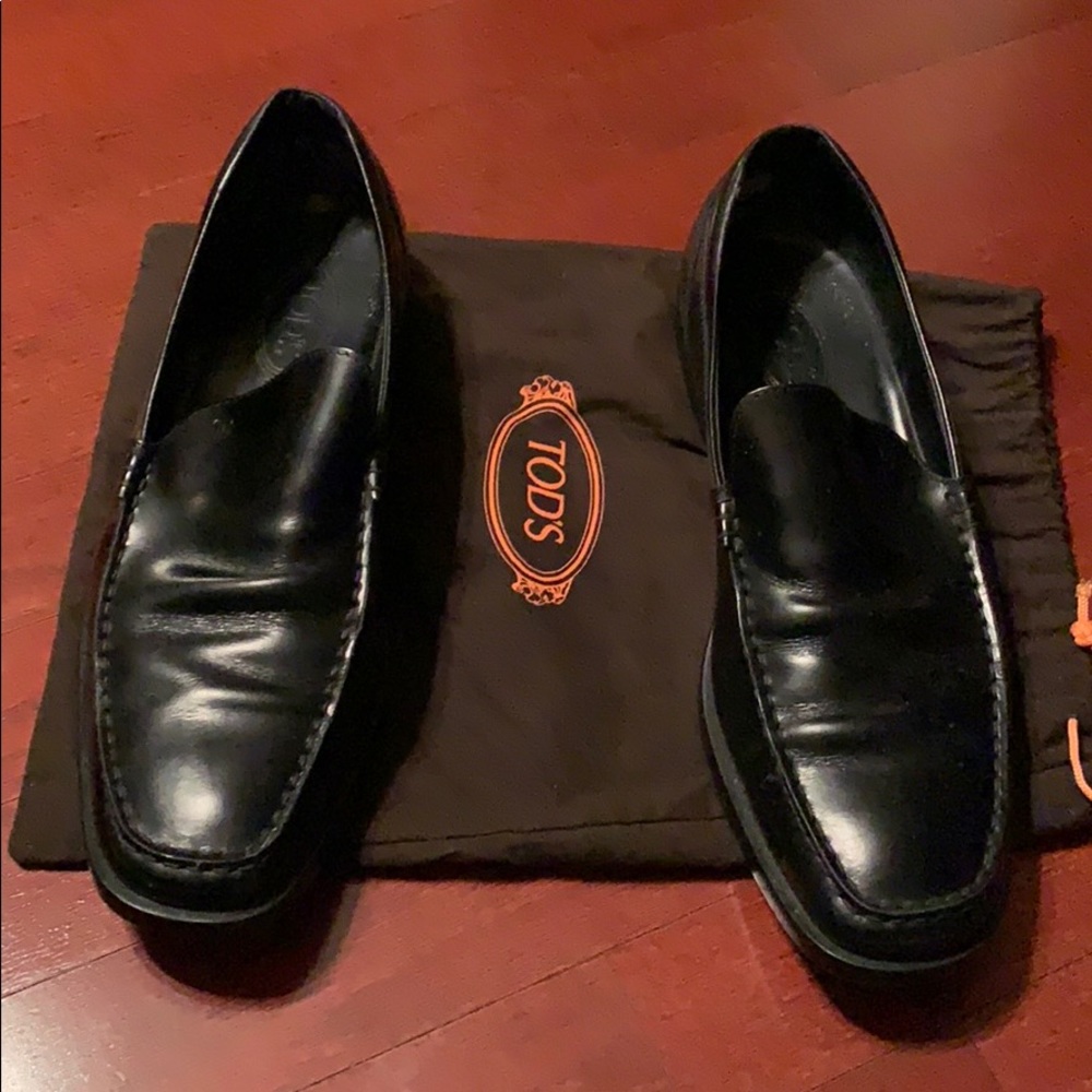 Tod’s black leather loafers